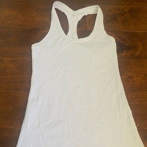 Lululemon white tank, not sure of the type of size, guessing a size 6.